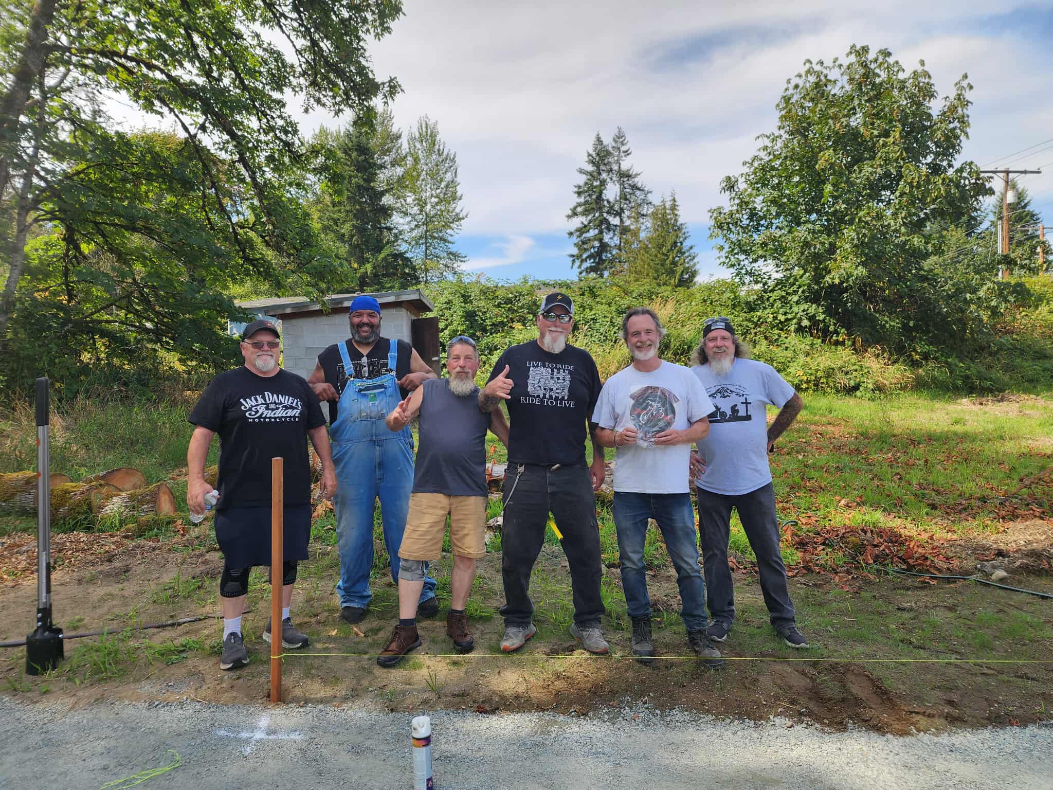 The memorial building crew with shovels at the beginning of the project